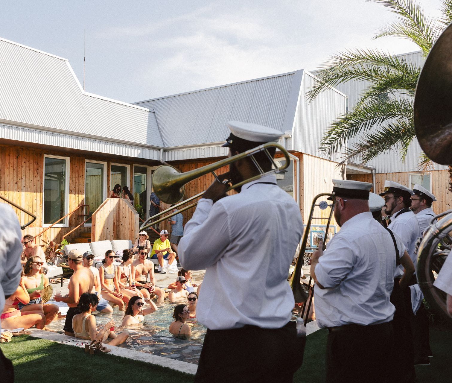 A brass band in the courtyard, mid wedding weekend